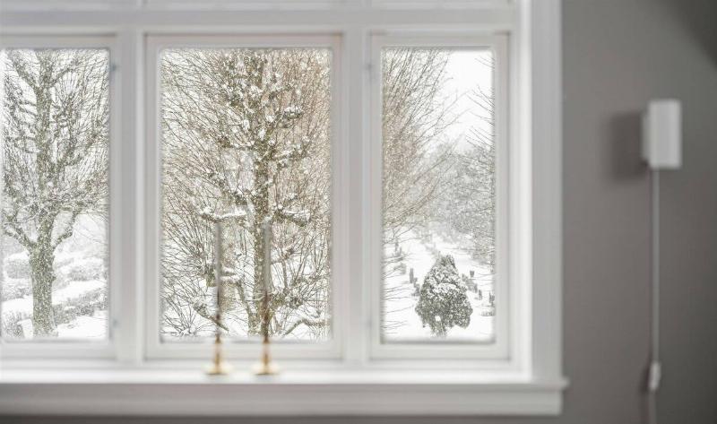 A window with a winter scene outside.