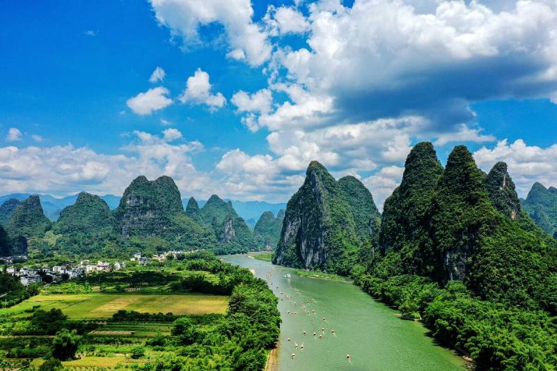 Tourists visit the Li River on a raft in Guilin, South China's Guangxi Zhuang Autonomous region, Aug 8, 2024.