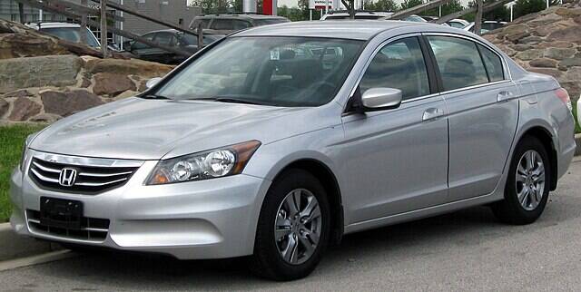 Silver 2011 Honda Accord parked on the side of a road