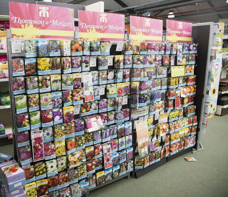 Thompson & Morgan plant seeds on display inside a garden center, Woodbridge, UK