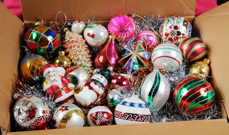 A box of Christmas ornaments and decorations.