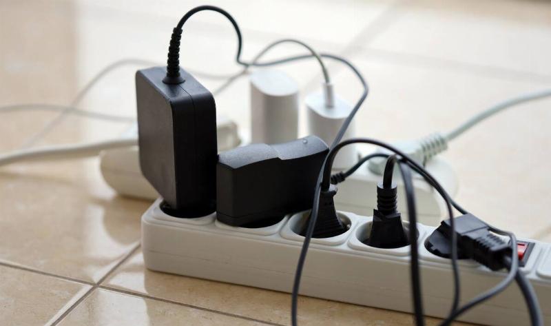 A power bar with something plugged into every outlet.