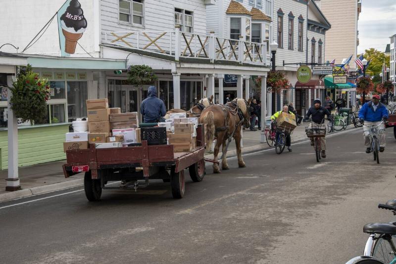Mackinac Island, Michigan, Only horses and bicycles allowed on the island. Horse and wagon delivering goods to local businesses.