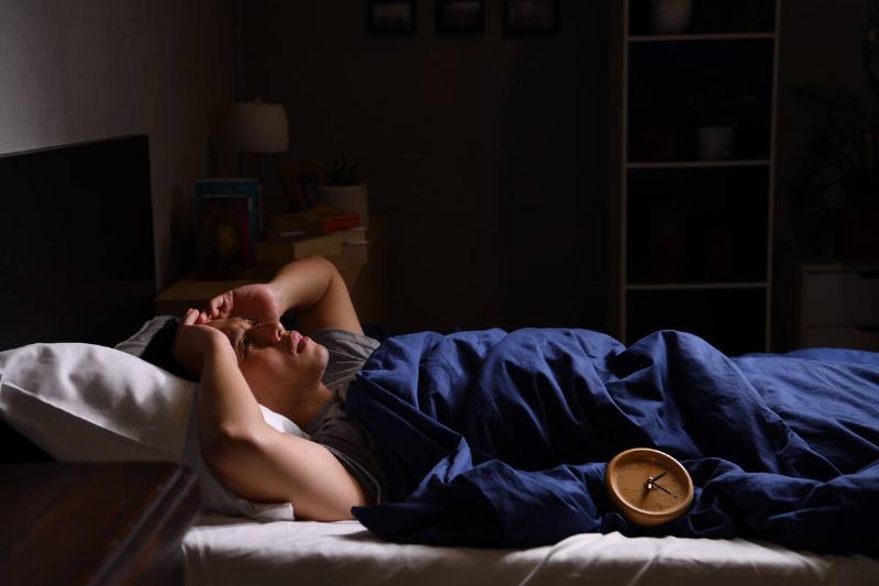 Man waking up in the middle of the night to sound. 