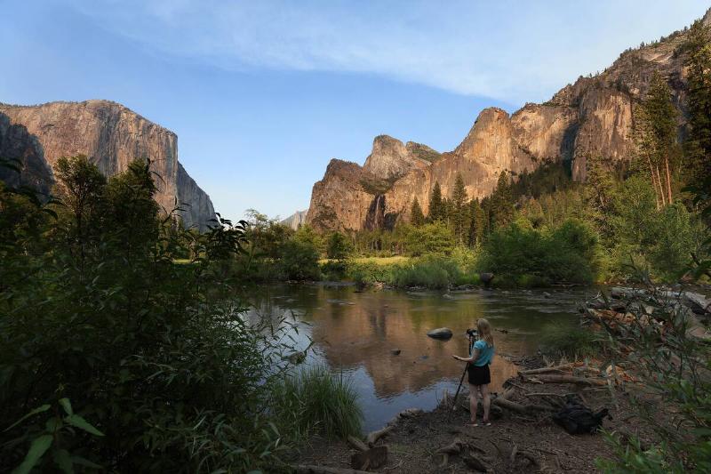 A Yosemite National Park visitor takes a photo on July 12, 2022 in Yosemite Ntl Park, California.