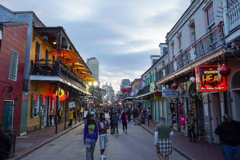 People walk on Bourbon Street on November 29, 2025 in New Orleans, Louisiana