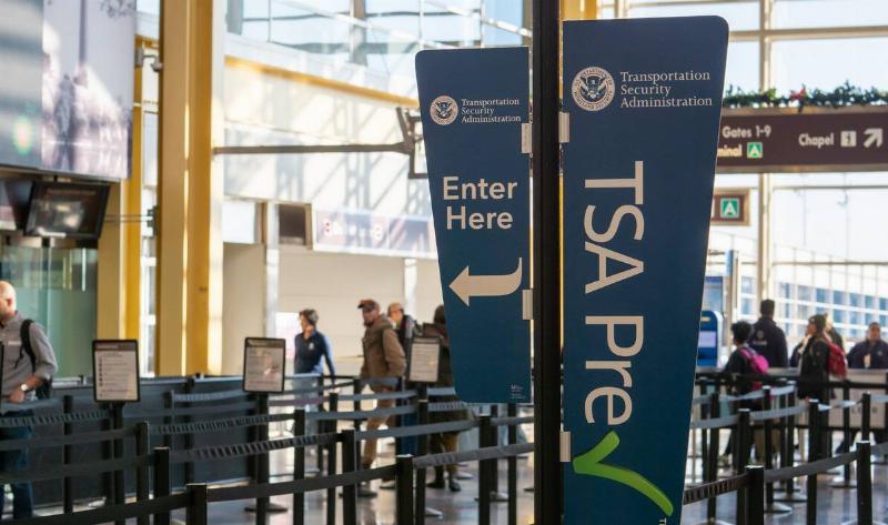 A sign for the TSA line.