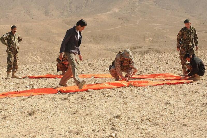 Afghan Air Force Life Support Personnel practice using signaling devices.