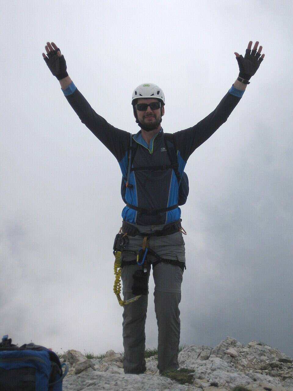 Man signaling Yes using his arms. 