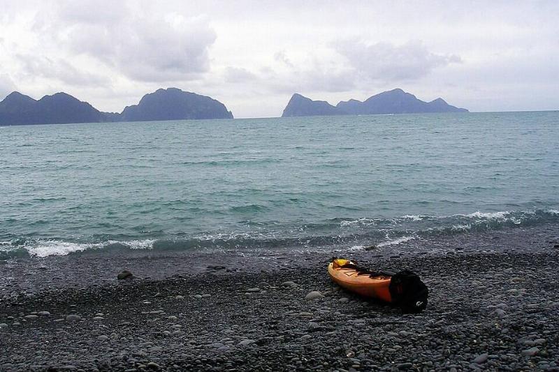 A kayak on North Beach, Caines Head.