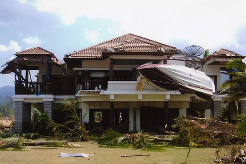 Speedboat on building from a Tsunami in 2004 in Thailand.
