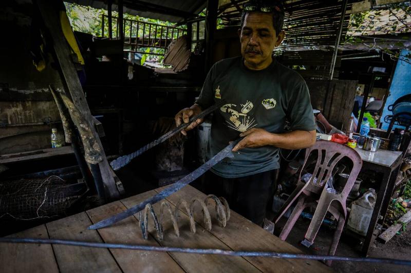 The traditional Malaysian machete called parangs are being produced at a workplace in Kuala Lumpur, Malaysia on June 24, 2021.
