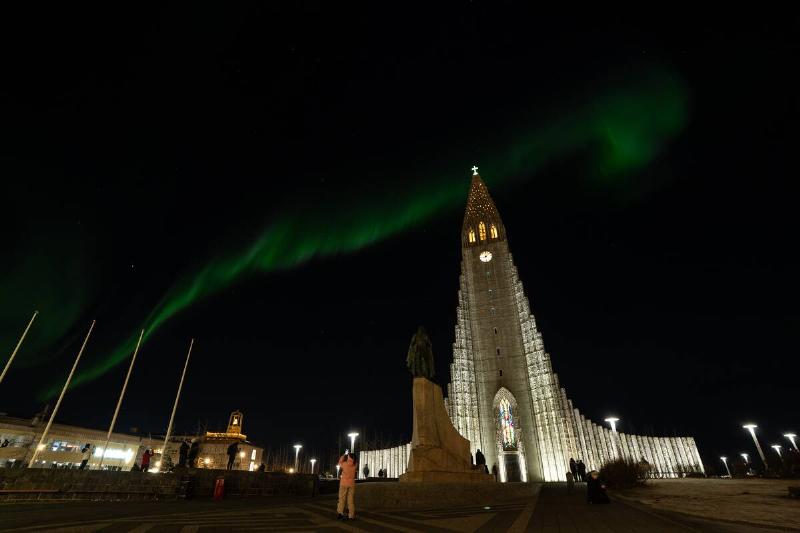 A powerful geomagnetic storm triggered vivid Northern Lights lit up the night sky around the Hallgrimskirkja Cathedral in Reykjavik, Iceland.