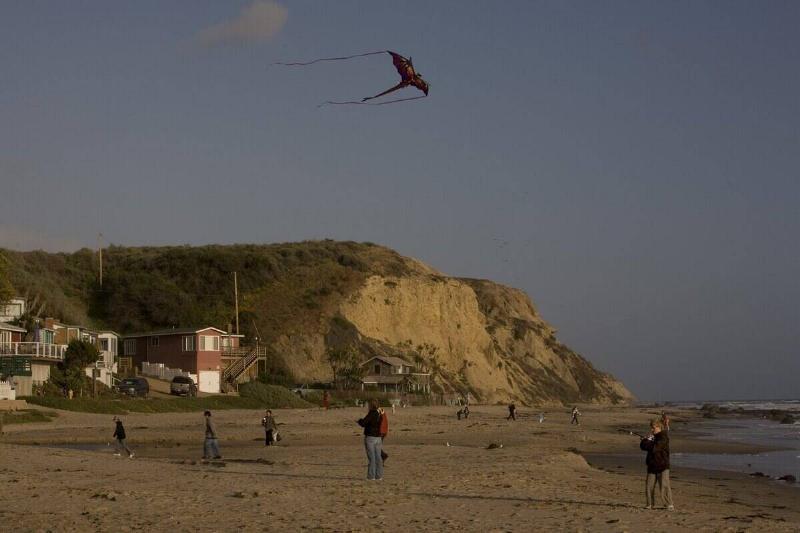 Kids fly their kites at Crystal Cove State Park as viewed in this 2009 Newport Beach, California.
