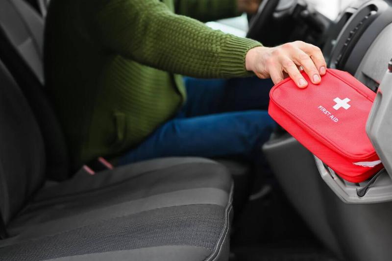 A first aid kit stored in the car glovebox. 