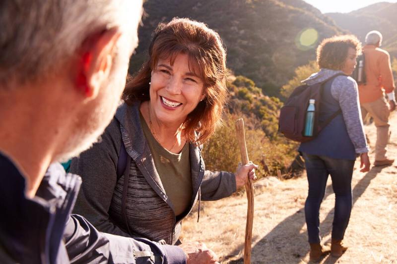 A group of senior friends hiking together. 