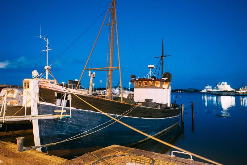 View Of Fishing Marine Boat, Powerboat At Pier In Evening Night Illuminations.