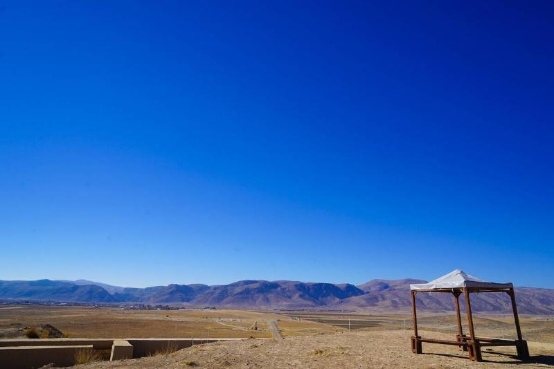 A small shelter in a desert. 