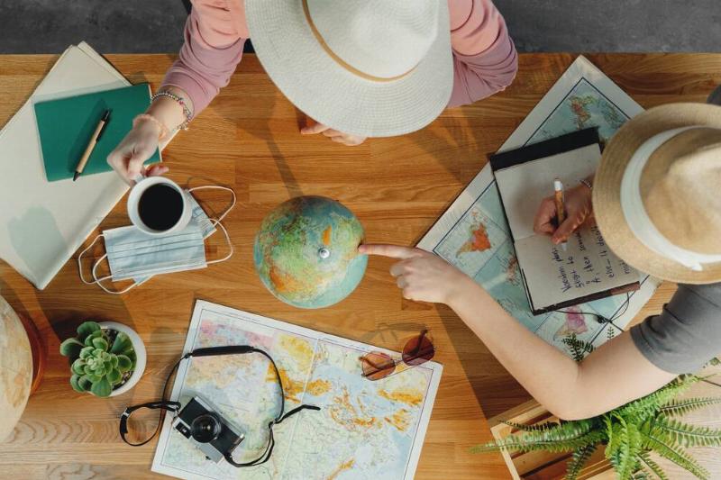 Two people researching a vacation. 