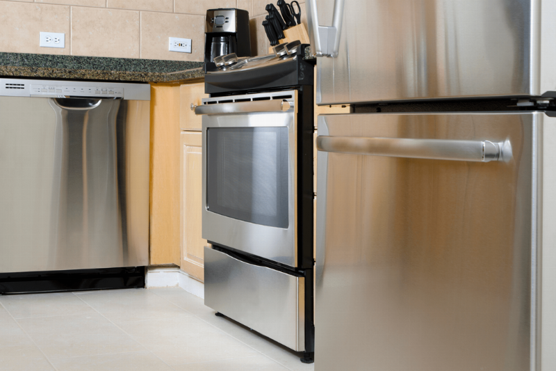 A stainless steel oven and fridge.