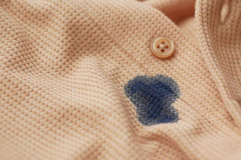 A blue stain on an orange shirt. 
