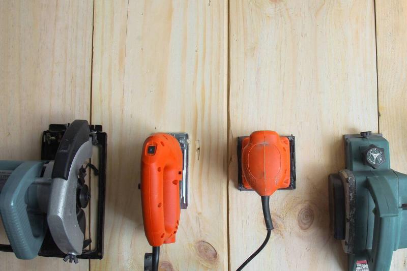 Power tools on a wooden table. 