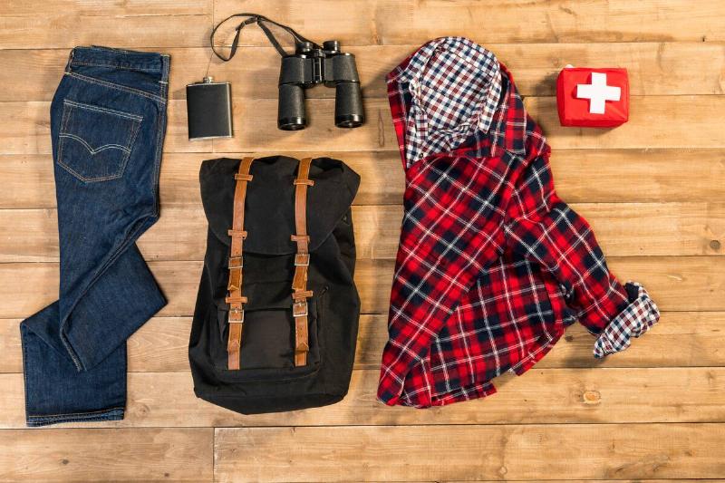 flat lay shot of traveler clothing & backpack
