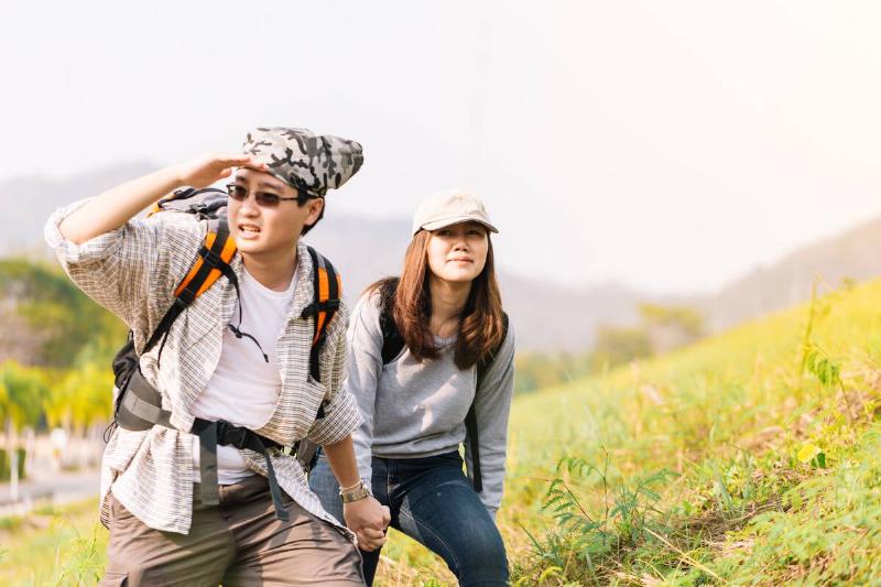 couple hiking sunny adventure trail