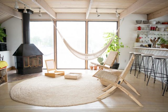 indoor hammock chair by the fireplace