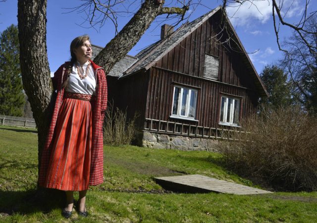 A woman in typical costume in the Soomaa National Park near Parnu, Estonia. This bog and wetland area is a unique habitat. Picture By: www.thetraveltrunk.net