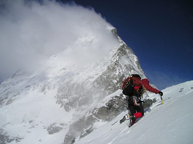 Survival gear is always weight worth carrying when climbing in the snow