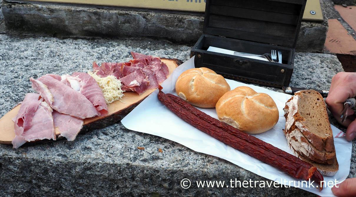 Meats and smoked sausage on the food walking tour in Vienna, Austria.