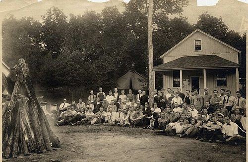Pinchot (center, with dog) visits children attending The School of Forestry Summer Camp in 1910