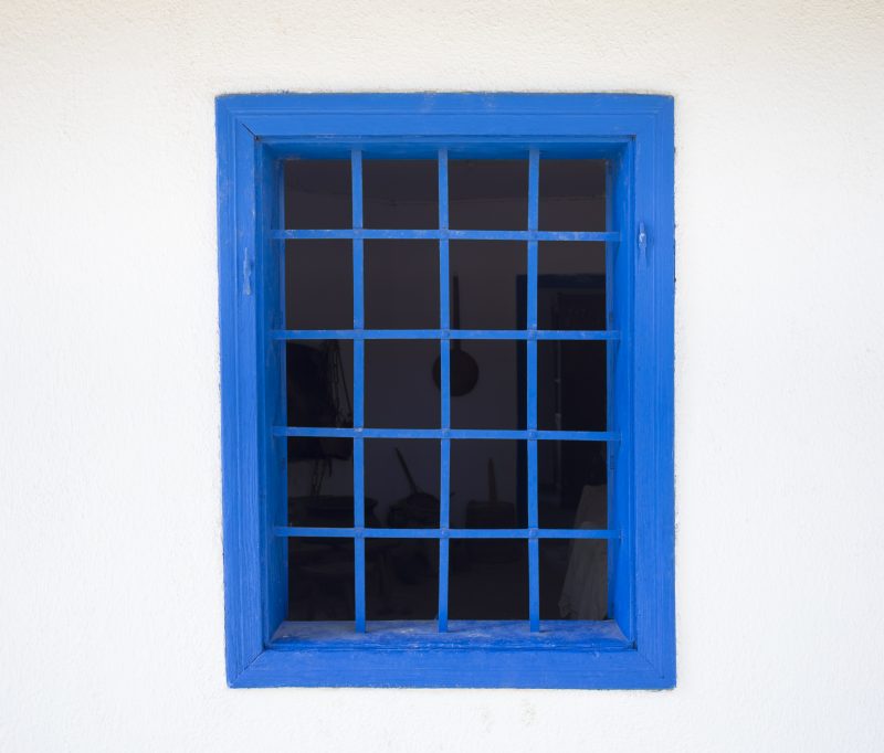 House window with security bars.