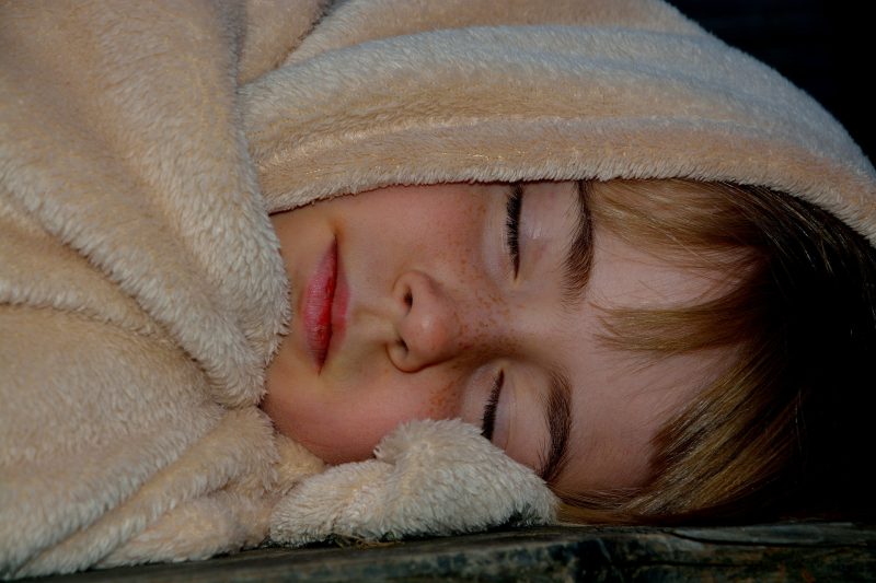 Child with a blanket
