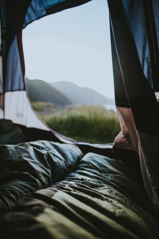 How do you ensure a good night sleep camping?