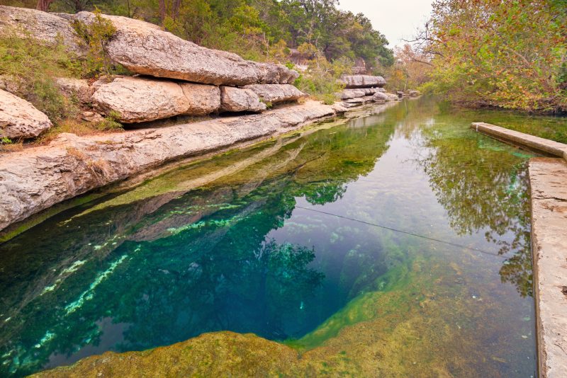 Jacob’s Well, a karstic spring in the Texas Hill Country flowing from the bed of Cypress Creek, located northwest of Wimberley, Texas, near Austin, Texas, USA.