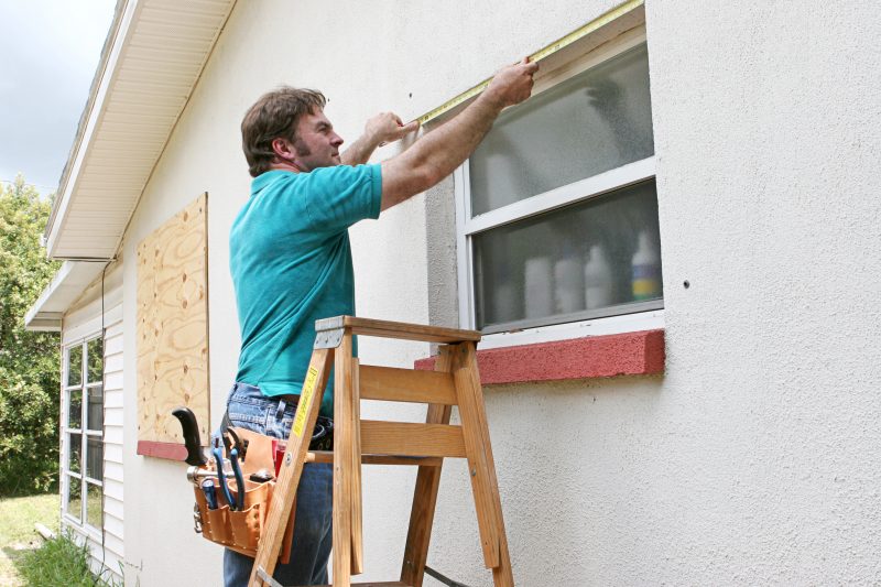 Measuring windows for hurricane shutters or plywood is the first step to protecting widows from flying debris.
