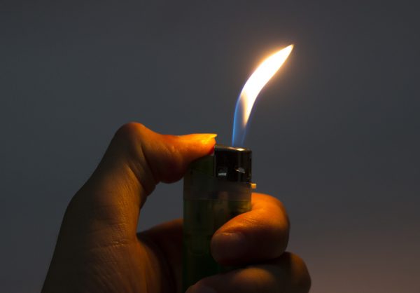 A simple lighter is often the easiest type of fire starter to use, even when it’s pouring rain outside.