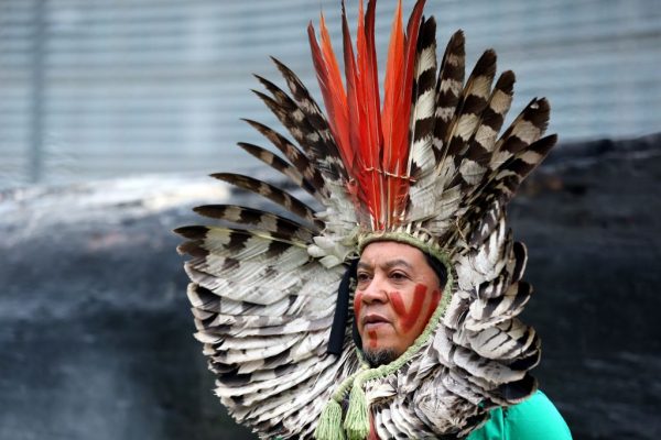 A group of environmentalist stage a protest to draw attention to devastation of Amazon rainforest in Brussels, Belgium on November 5, 2019. (Photo by Dursun Aydemir/Anadolu Agency via Getty Images)