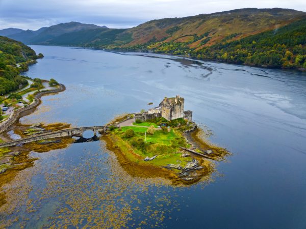 Aerial picture of Eilean Donan Castle on a small island where three sea lochs meet