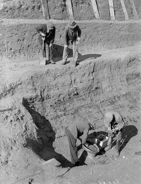 31st July 1939: Workmen sift through earth at the bottom of the excavation of the Anglo-Saxon burial ship at Sutton Hoo, Suffolk. (Photo by A. Cook/London Express/Getty Images)