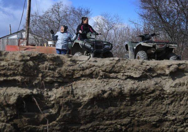 Villagers beside the eroding permafrost tundra at Yupik Eskimo village of Napakiak, on the Yukon Delta in Alaska on April 18, 2019.  MARK RALSTON/AFP via Getty Images