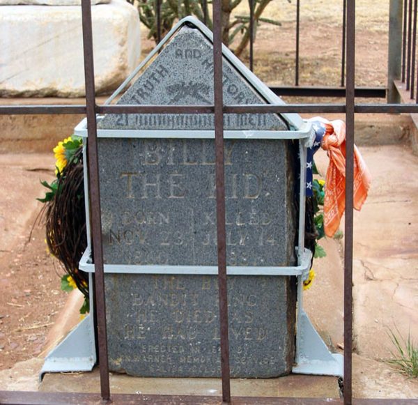 Billy the Kid's Grave is surrounded by metal bars 