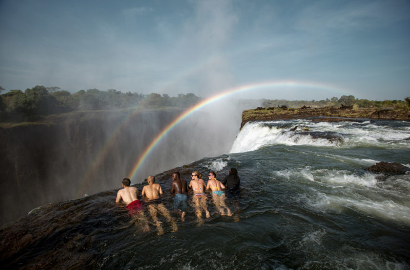 Tourists take in the sites at Devil's Pool in Zambia 