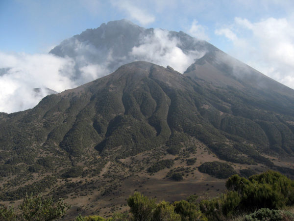 View of Mount Meru with its tops shrouded in clouds