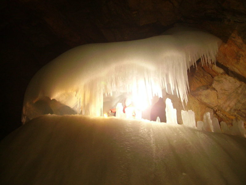 Light shining through ice in a cave