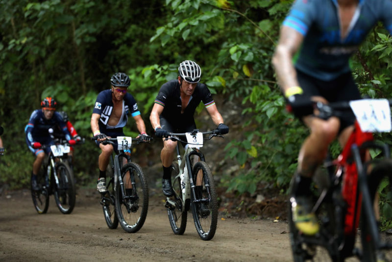 Cyclists riding along a dirt trail