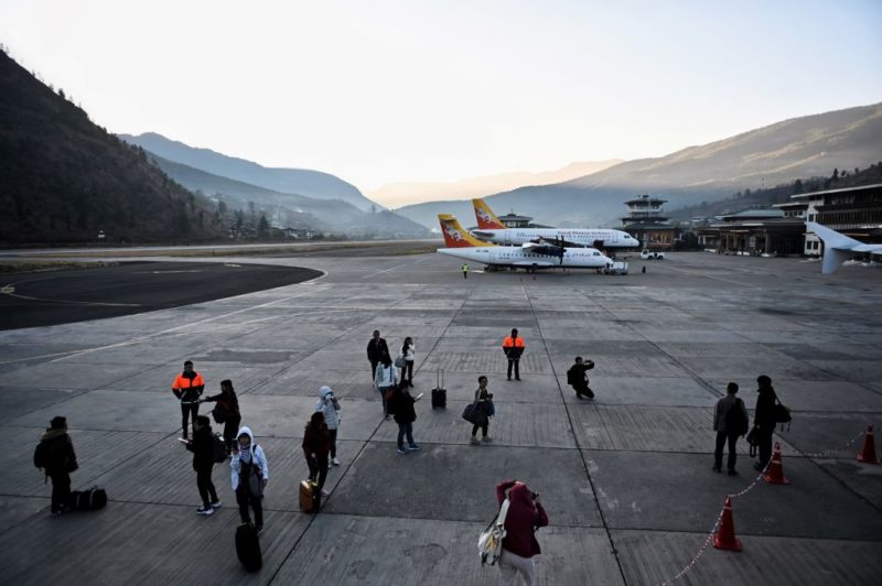 People standing on the tarmac at Paro International Airport