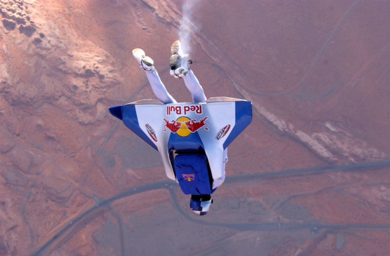 BASE jumper falling headfirst while wearing a wingsuit